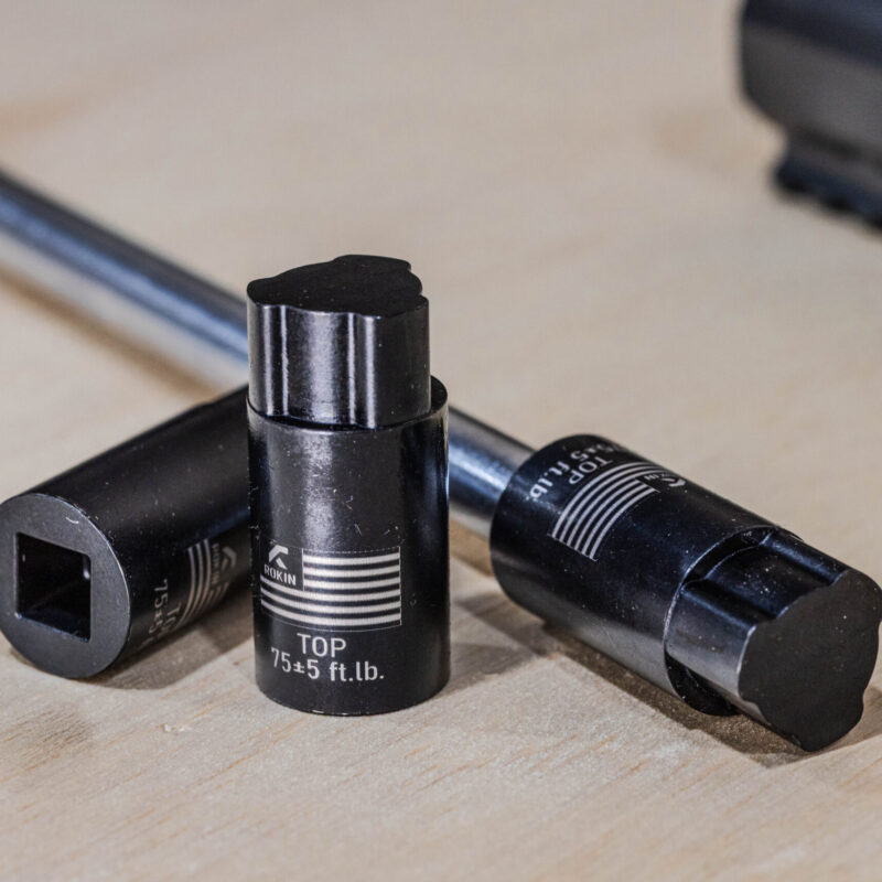 Rokin Aero Solus action wrench socket on a 3/8 inch drive extension beside a rifle action